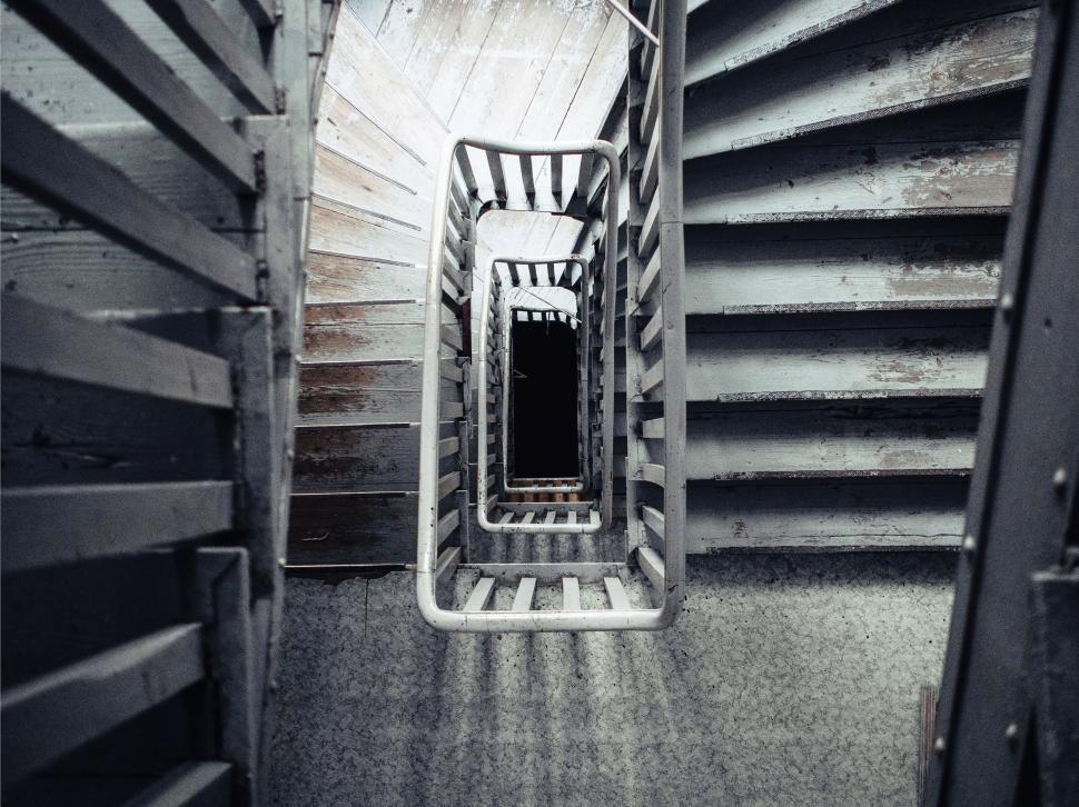 Free Image of Abstract view down a spiral staircase, symmetrical design 