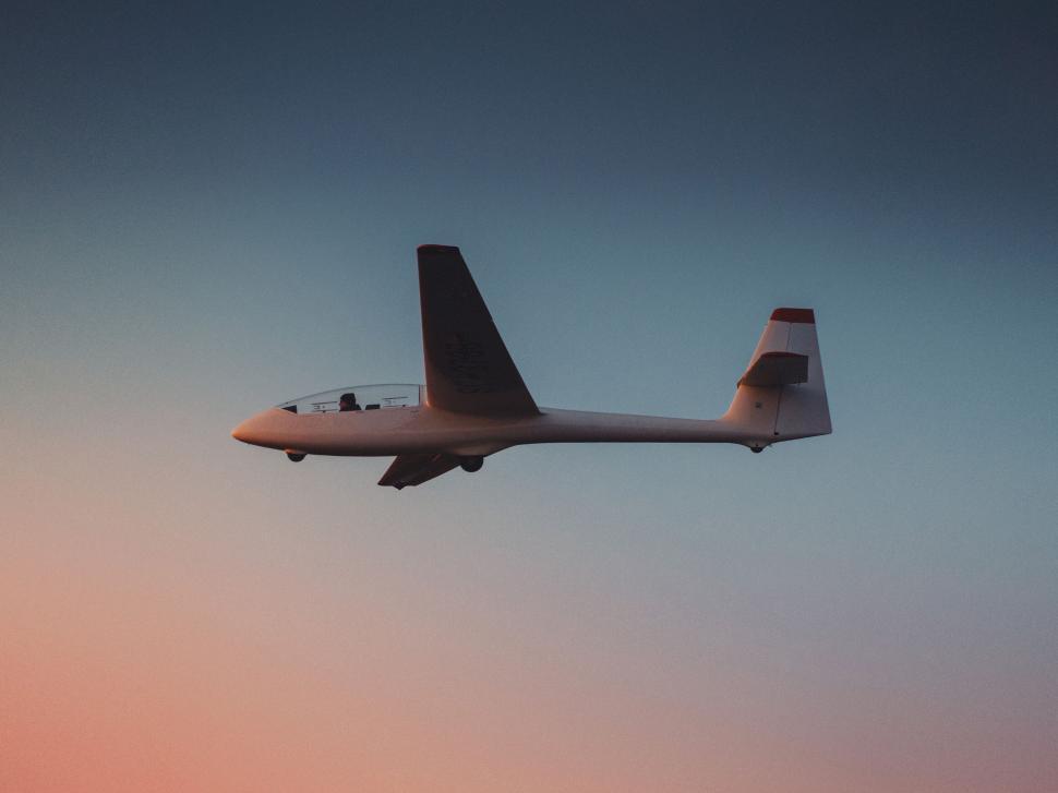 Free Image of Glider aircraft in flight during sunset close-up 