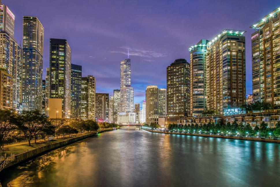 Free Image of Chicago cityscape at night with glowing skyscrapers 