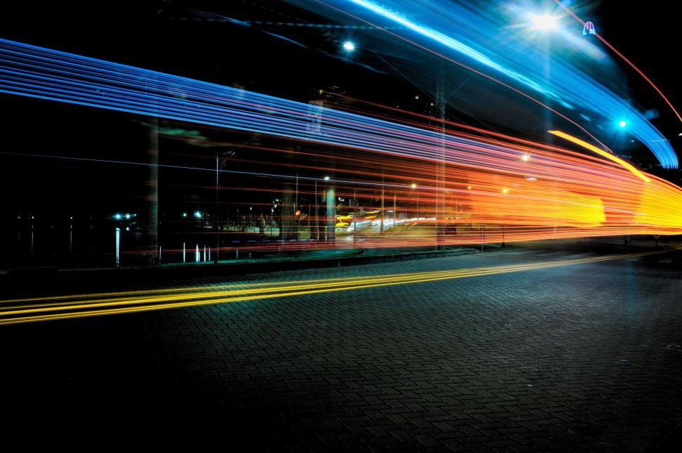 Free Image of Vibrant light trails captured in a nighttime cityscape. 