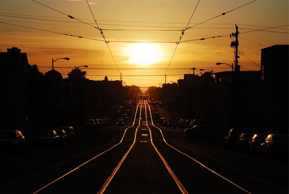 Free Image of Sunset view of a railway track extending into horizon 