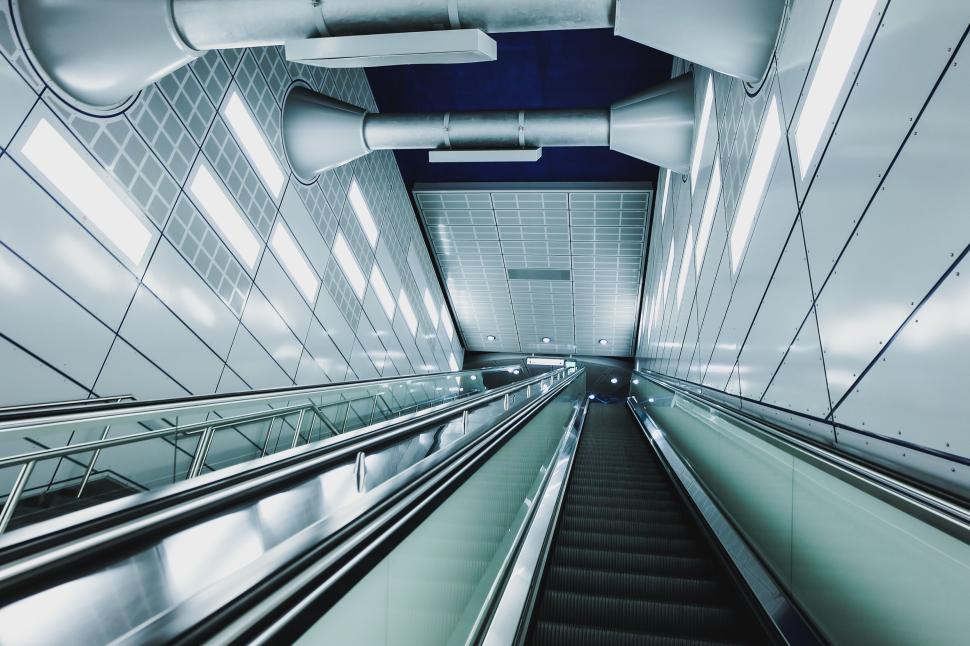 Free Image of Futuristic escalator in brightly lit modern building 