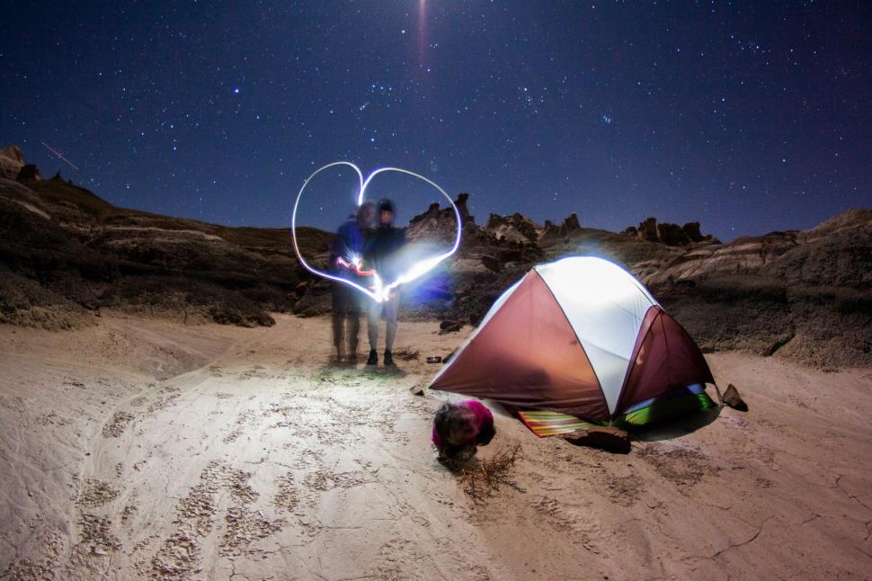 Free Image of Night Camping under Stars with Heart-shaped Light Trail 