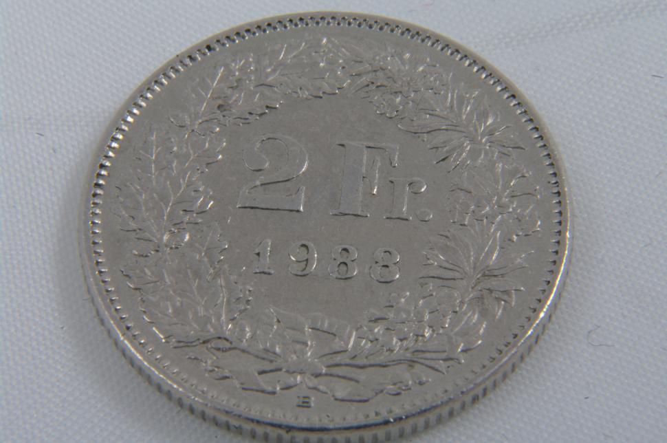 Free Image of Close Up of Coin on White Surface 