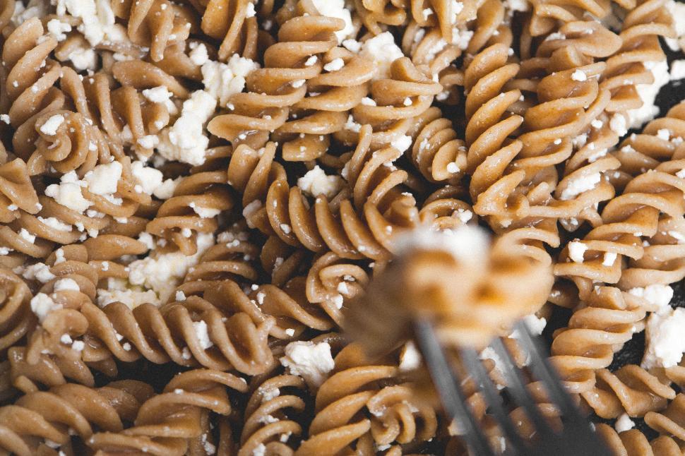 Free Image of Close-up of delicious pasta with cheese, fork in focus 