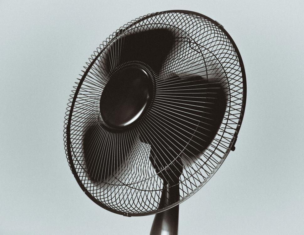Free Image of Monochrome image of a standing electric fan in focus 