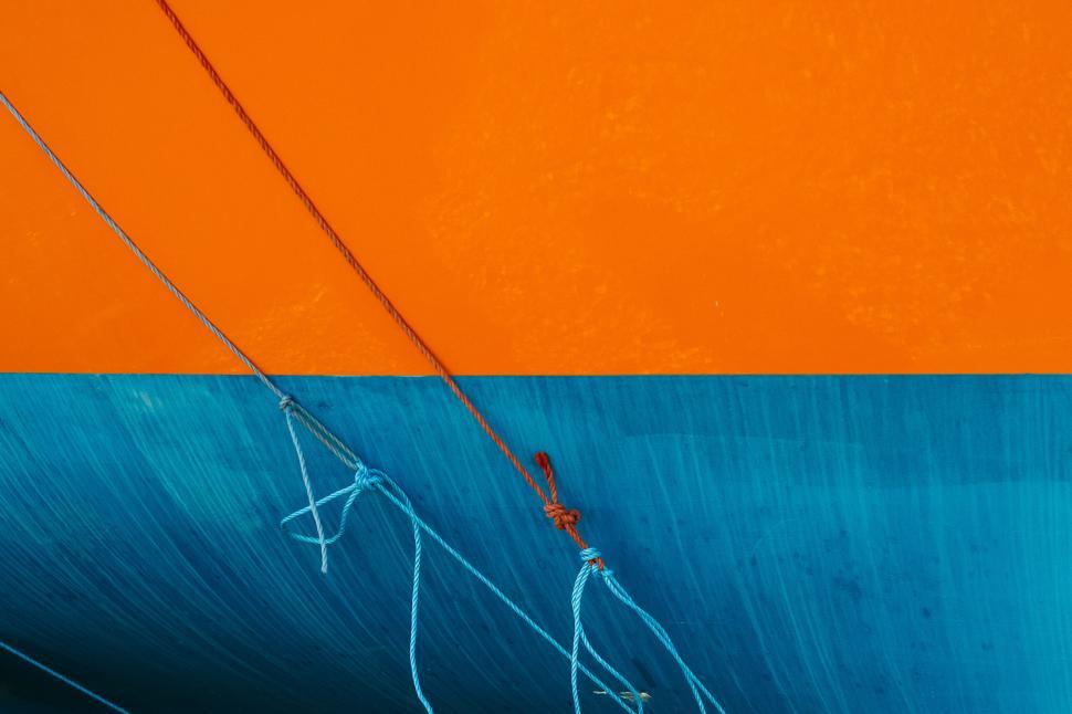 Free Image of Colorful close-up of boat hull with ropes and cables. 
