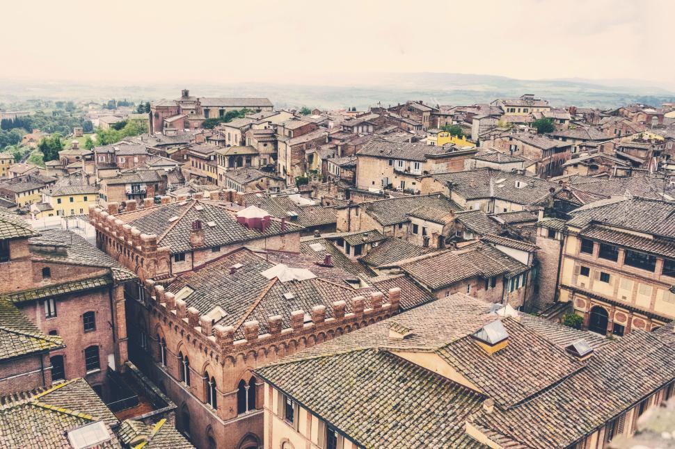Free Image of Aerial view of an old town with tiled rooftops 
