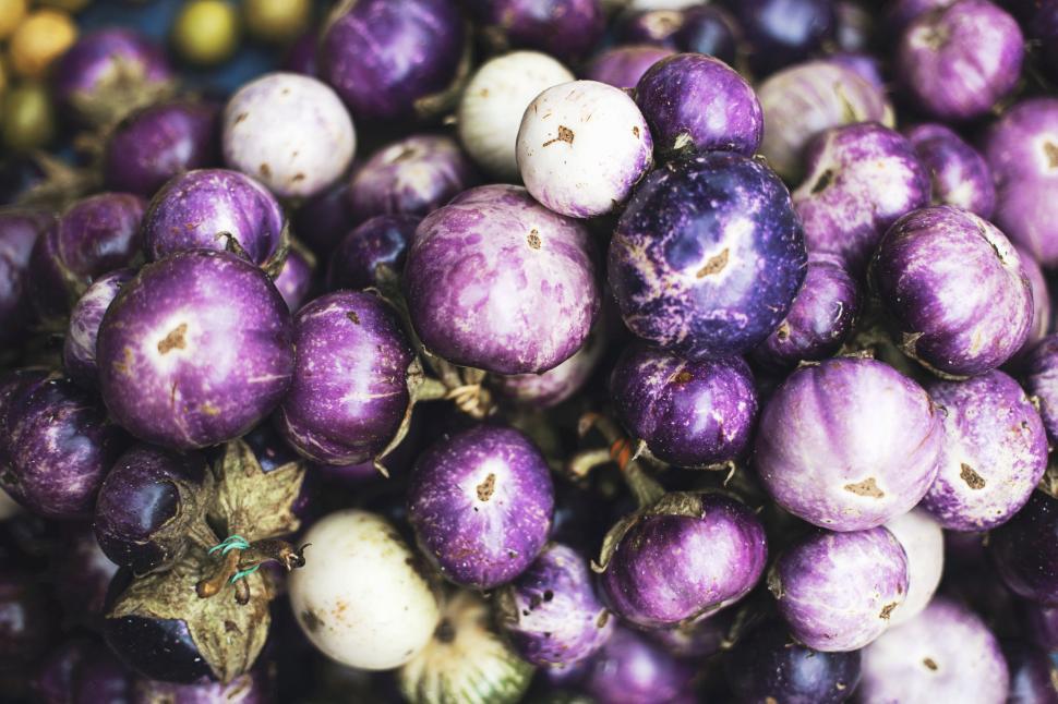 Free Image of A pile of purple eggplants showcasing different shades 