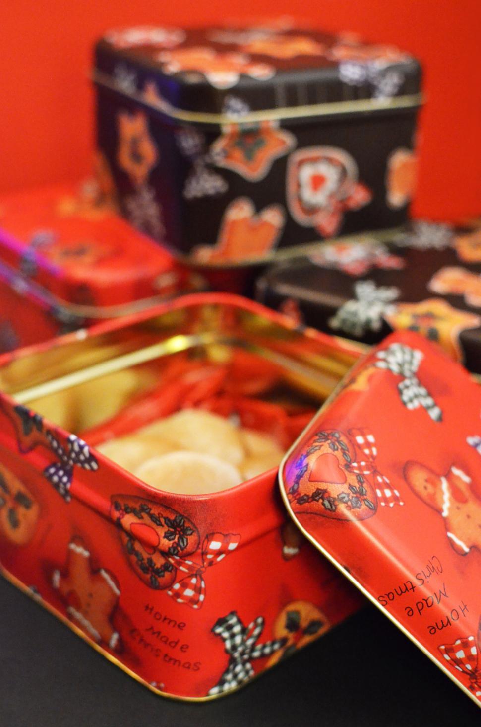 Free Image of Open Christmas gift boxes with colorful festive design. 