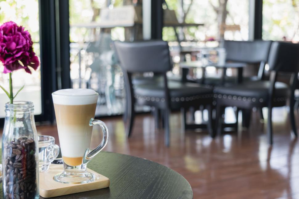 Free Image of Latte with frothy layers in chic modern cafe 