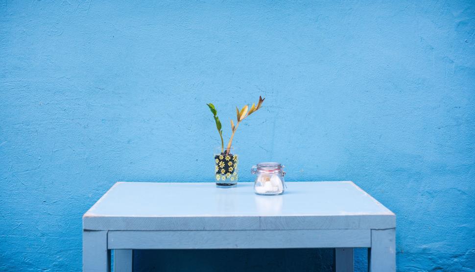 Free Image of Minimalistic blue table against a striking blue wall 