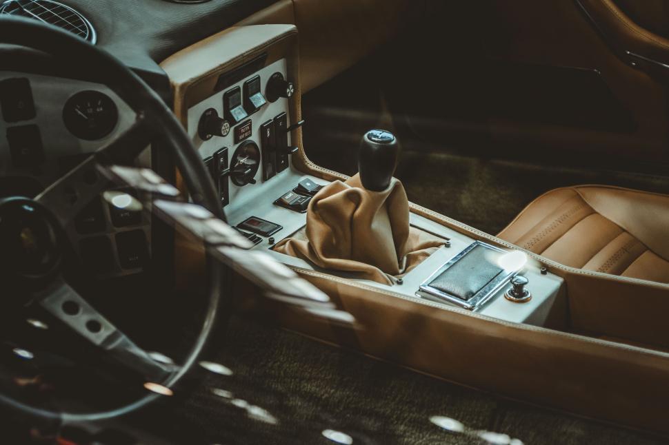 Free Image of Vintage car interior showing gear shift and dashboard. 