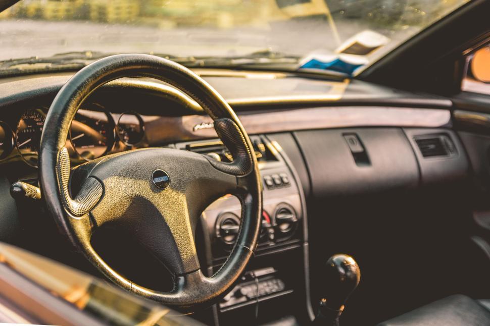 Free Image of Interior view of car dashboard with steering wheel 