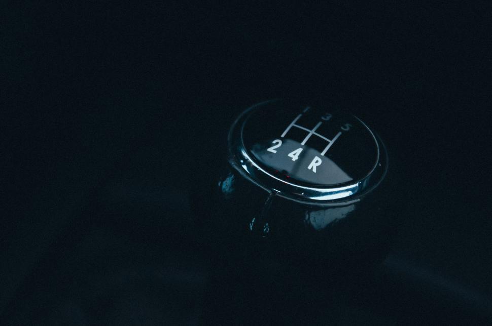 Free Image of Close-up of a car gear shift knob emphasizing simplicity 