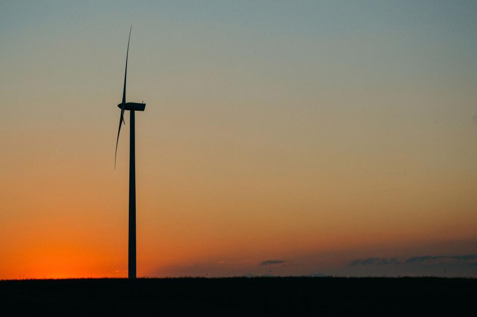 Free Image of Wind turbine silhouette against a beautiful sunset 