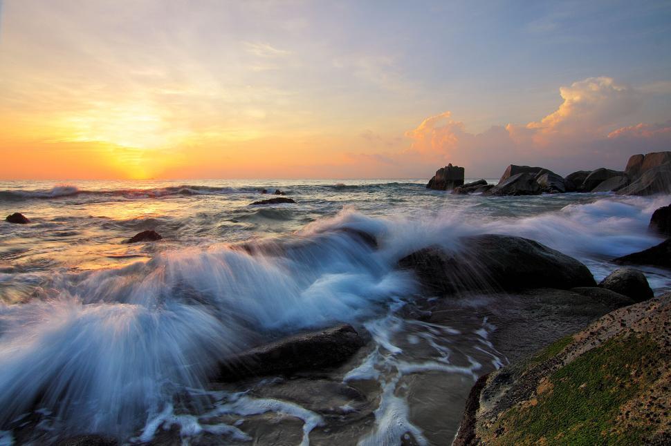 Free Image of Sunset waves crashing rocks dynamic seascape dramatic view 