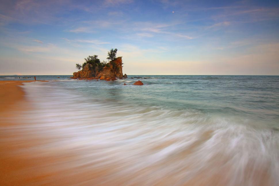 Free Image of Island view with waves crashing on sandy tropical shore 
