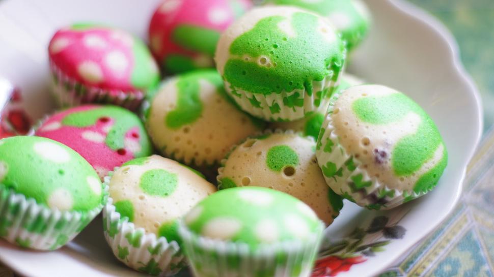 Free Image of Vibrant colorful steamed cupcakes displayed on white plate 