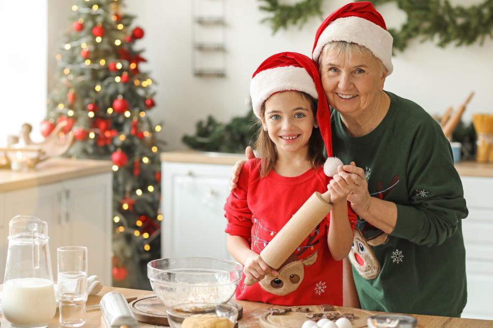 Free Image of Grandmother and child baking cookies for Christmas 