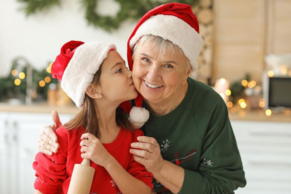 Free Image of Grandmother receiving affection from grandchild 