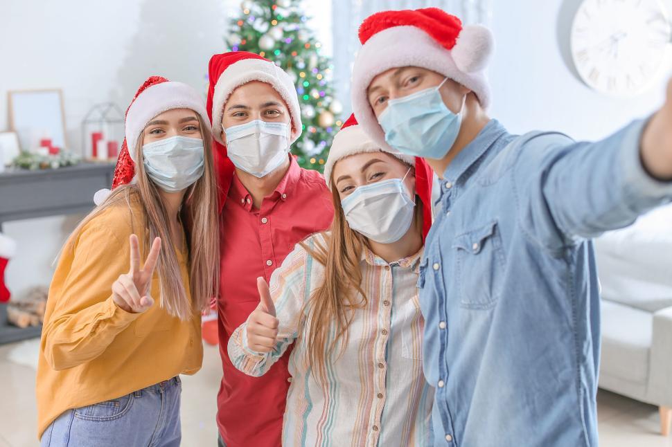 Free Image of Group selfie during Christmas celebration all smiling 