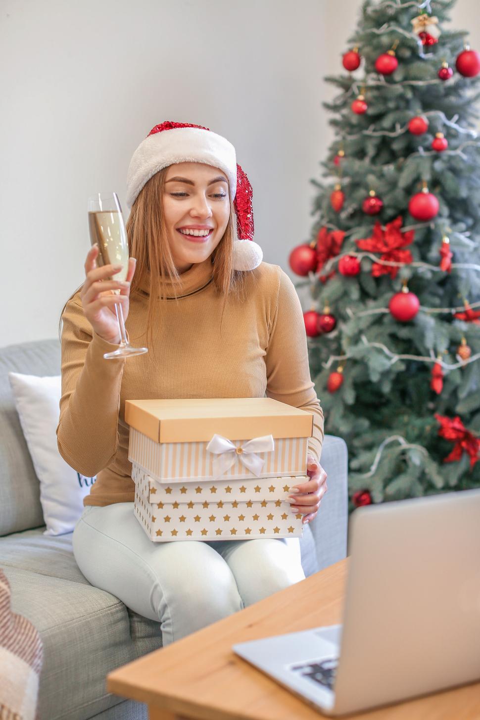 Free Image of Woman toasting with champagne during virtual celebration 