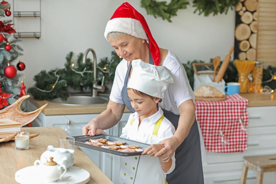 Free Image of Grandmother and child baking cookies in kitchen 