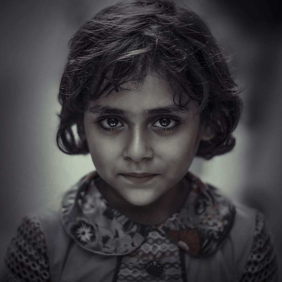 Free Image of Portrait of a serious young girl with flowered shirt 