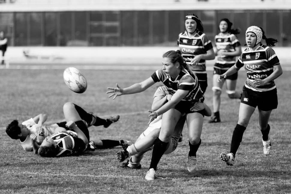Free Image of Rugby match showing intense action among female players 