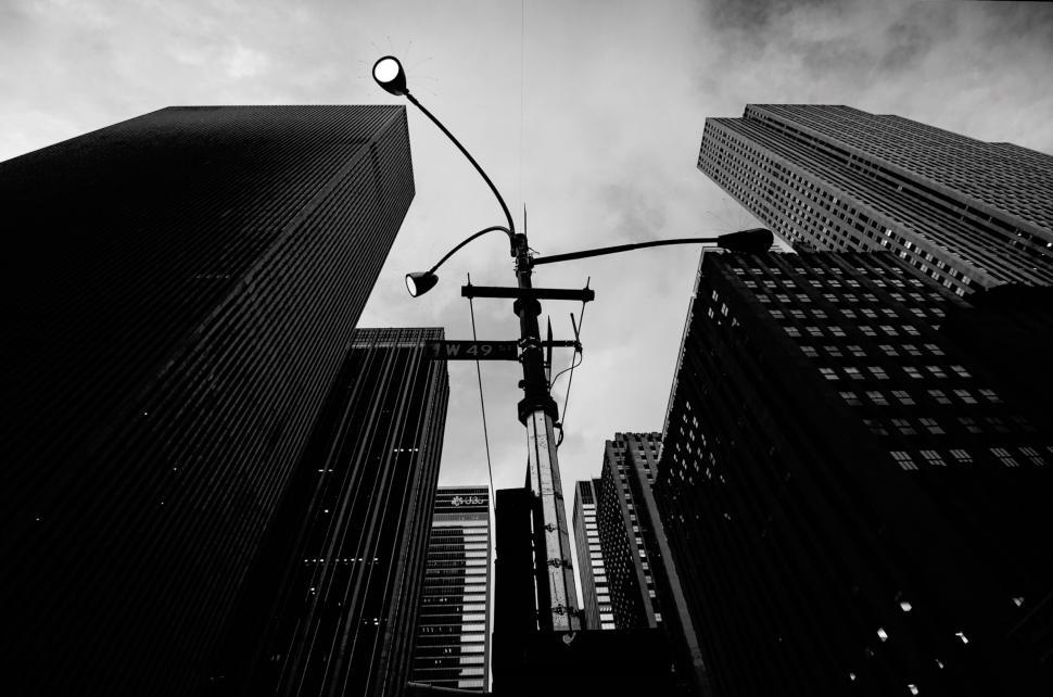 Free Image of Monochrome downtown with skyscrapers and street lights. 