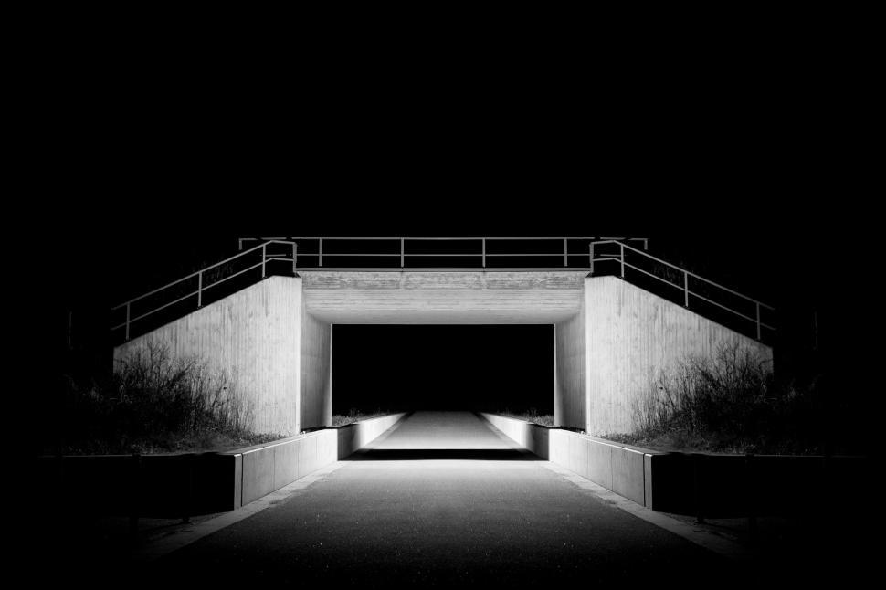 Free Image of Illuminated bridge at night with symmetric structure. 