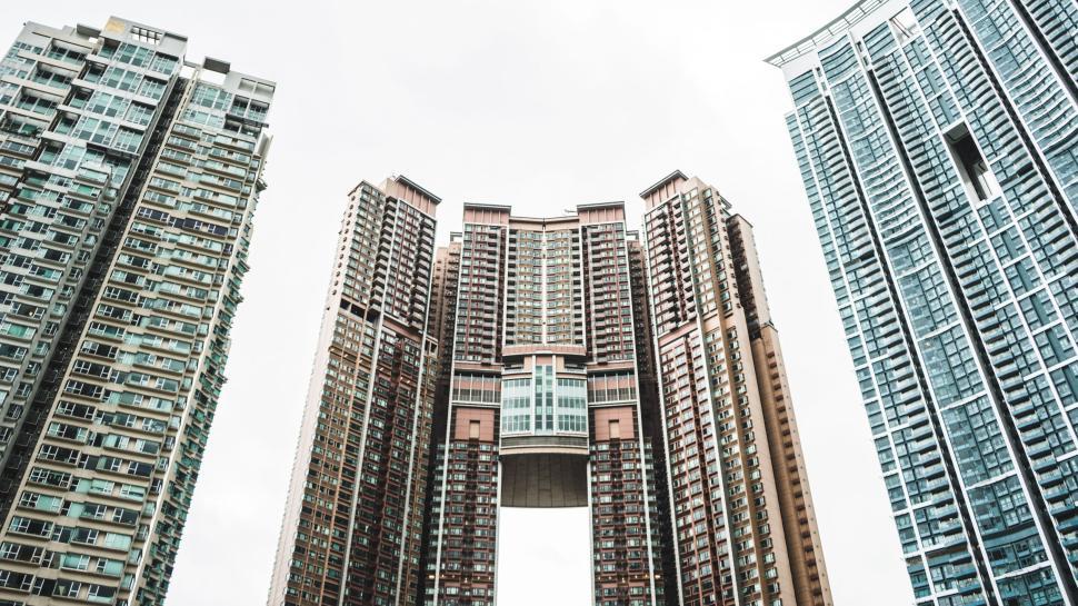 Free Image of Tall buildings interconnected in architectural marvel. 