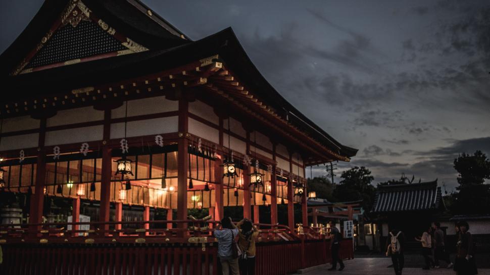 Free Image of Traditional Japanese temple at dusk, softly illuminated. 