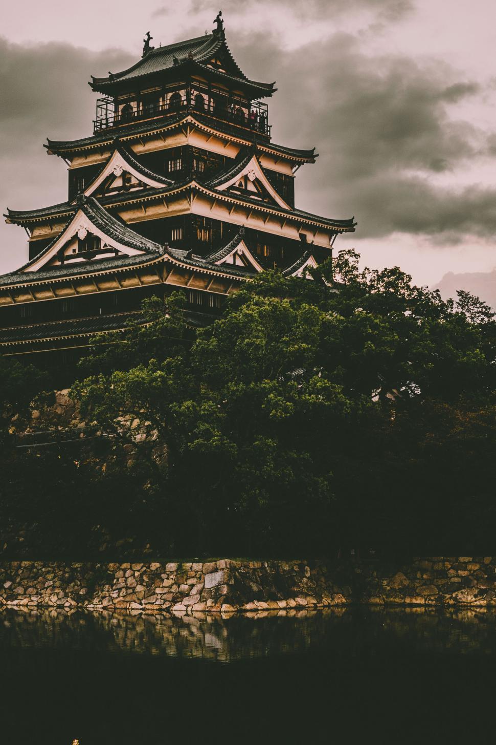 Free Image of Traditional Japanese castle with dramatic sky background 