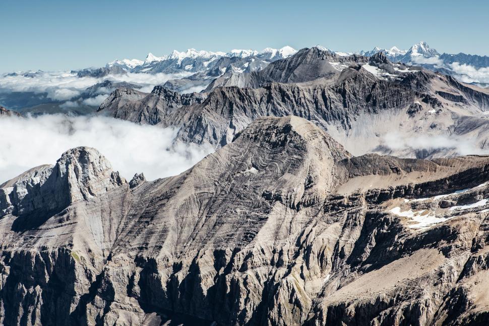 Free Image of Extensive rocky mountain range stretching to the horizon. 