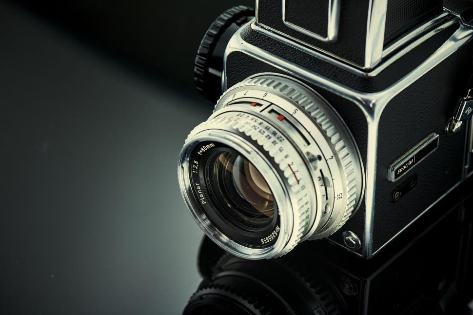 Free Image of Close-up of vintage camera with metallic finish lens. 