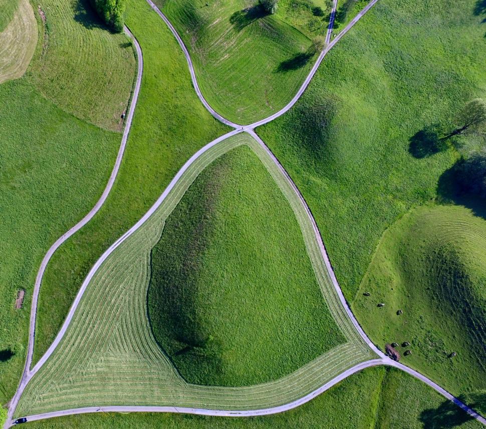 Free Image of Aerial view of green fields with intersecting paths 
