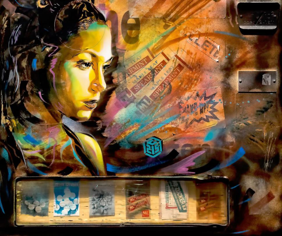 Free Image of Vivid street art portrait with colorful background details 