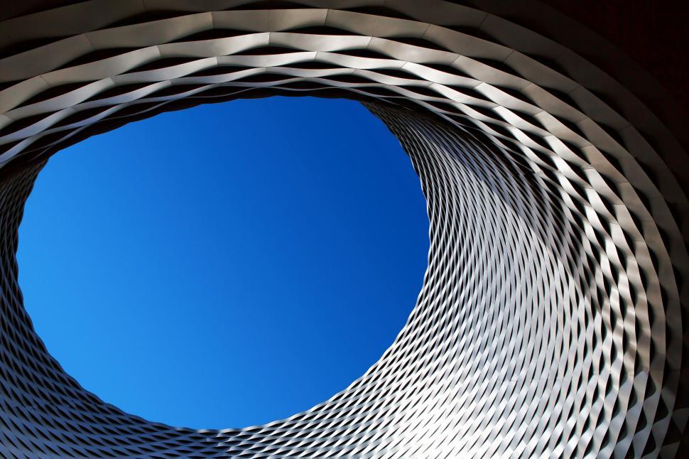 Free Image of Modern architectural structure forming circular sky view. 