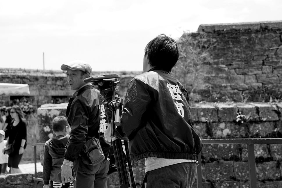 Free Image of Two people filming outdoor scene with camera equipment. 