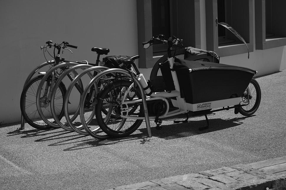 Free Image of Multiple bicycles parked near a cargo bike on street 