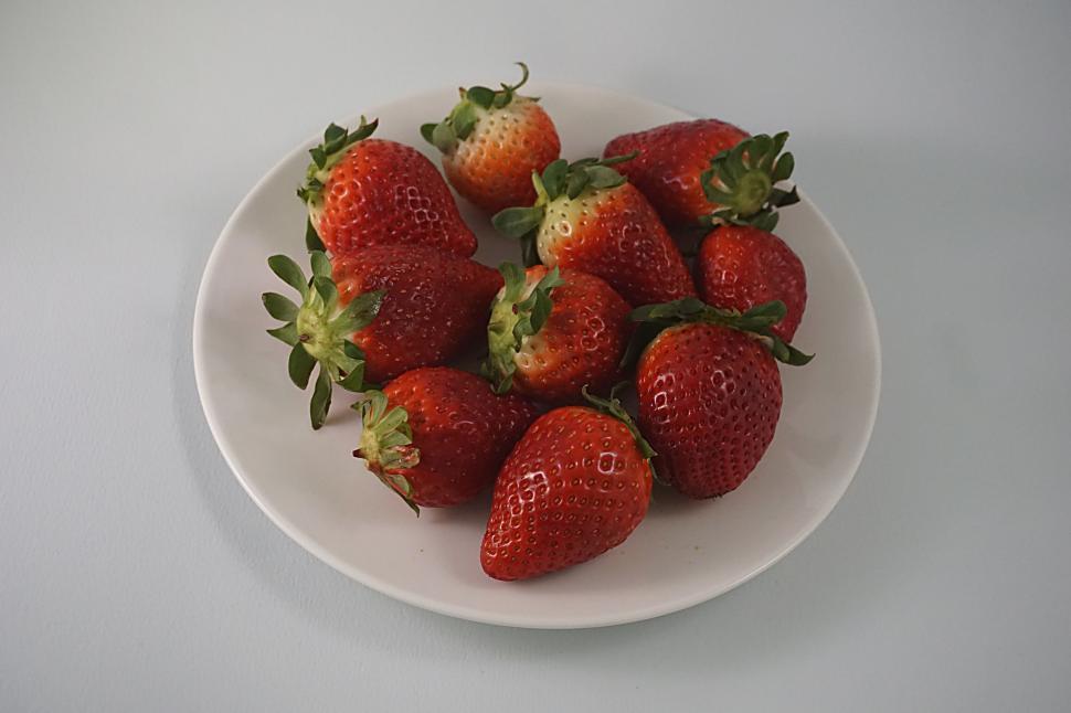 Free Image of Plate full of ripe strawberries ready to be enjoyed fresh. 