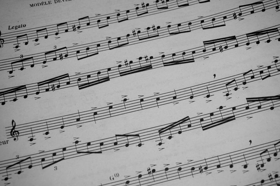 Free Image of Sheet music displaying musical notes and composition lines. 
