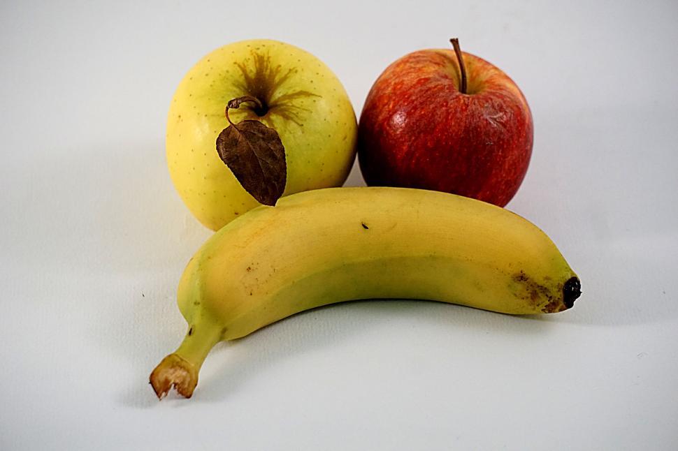 Free Image of Assorted fresh fruits including apples and banana on white. 
