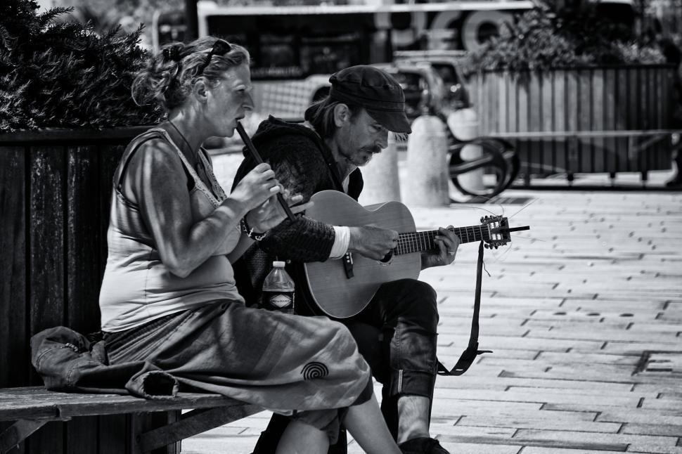 Free Image of Street musicians performing with guitar and singing. 