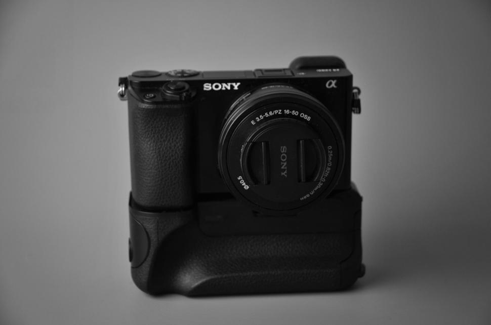 Free Image of Close-up of a Sony Alpha camera against a gray backdrop. 