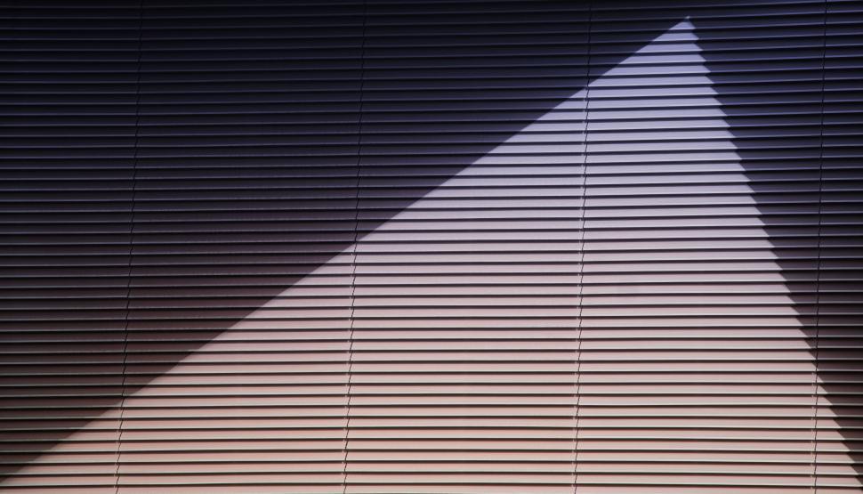 Free Image of Abstract play of light and shadows on window blinds 