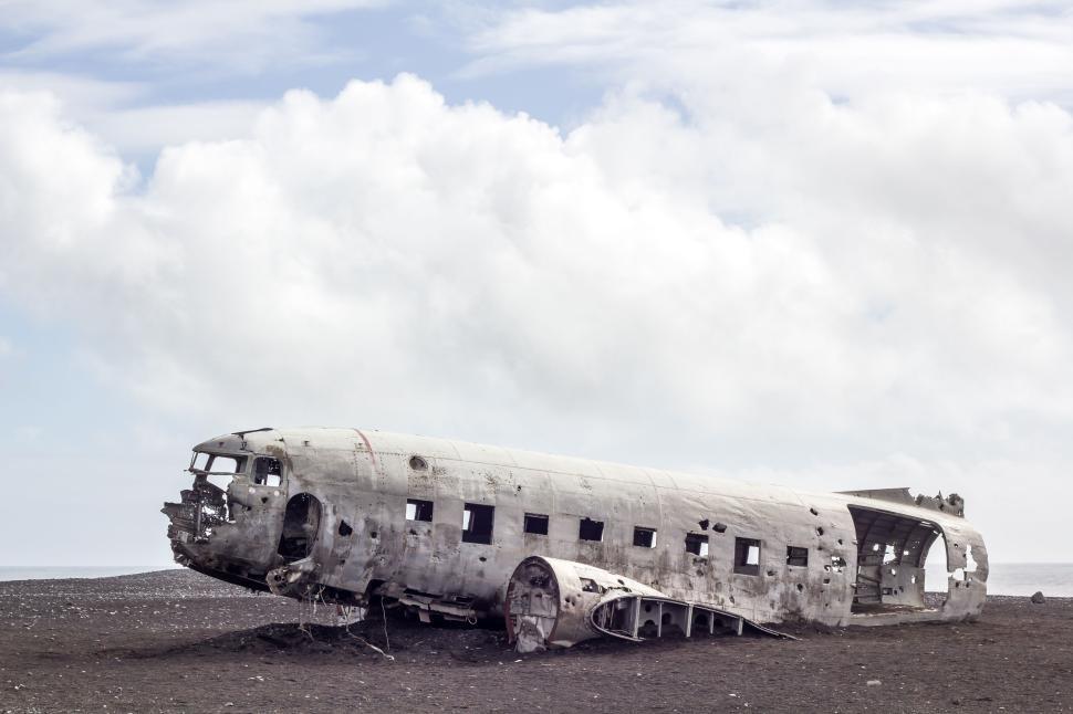 Free Image of Abandoned plane wreck in desolate landscape at daytime 