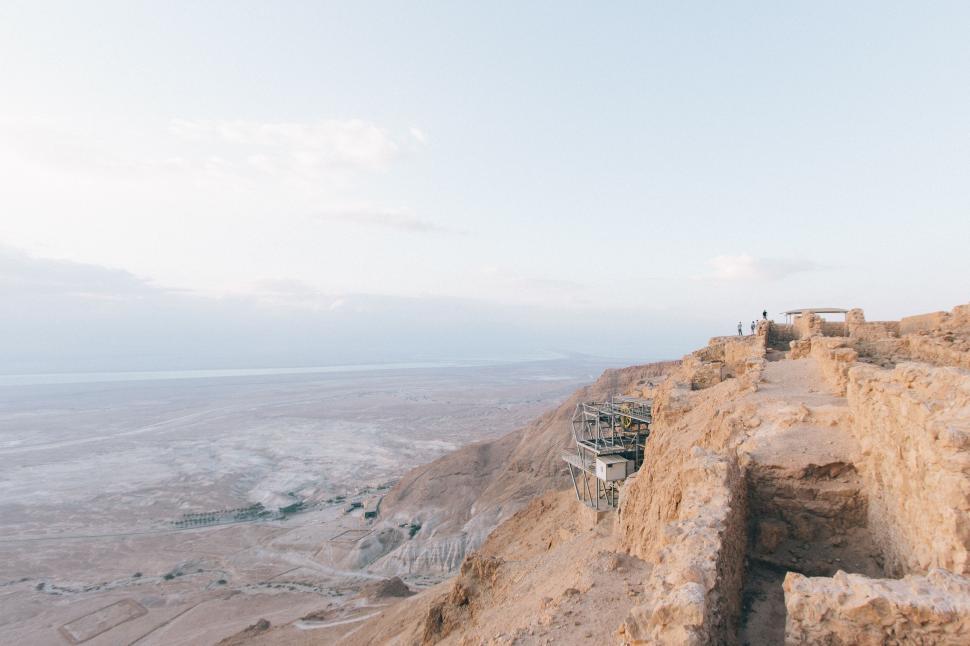 Free Image of Ancient ruins overlooking a vast desert landscape view. 